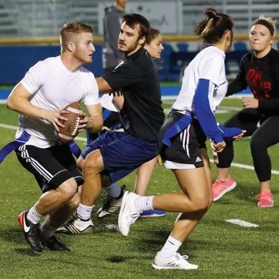 Students playing flag football