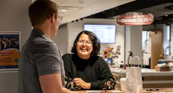 student chat during a social event