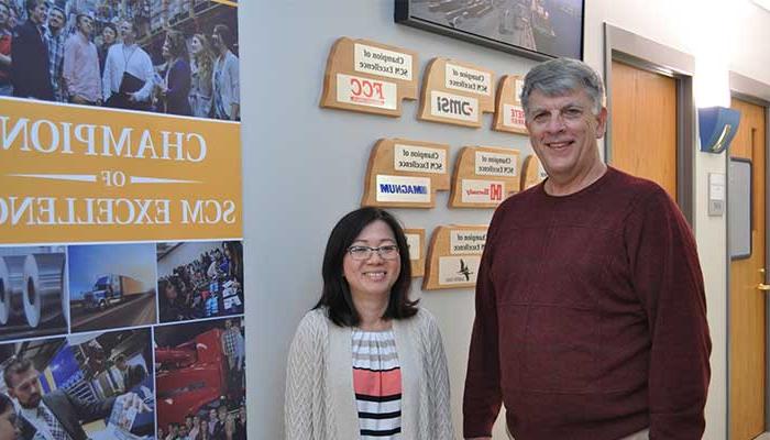 Dr. Benson & Dr.Chau in front of SCM Center 